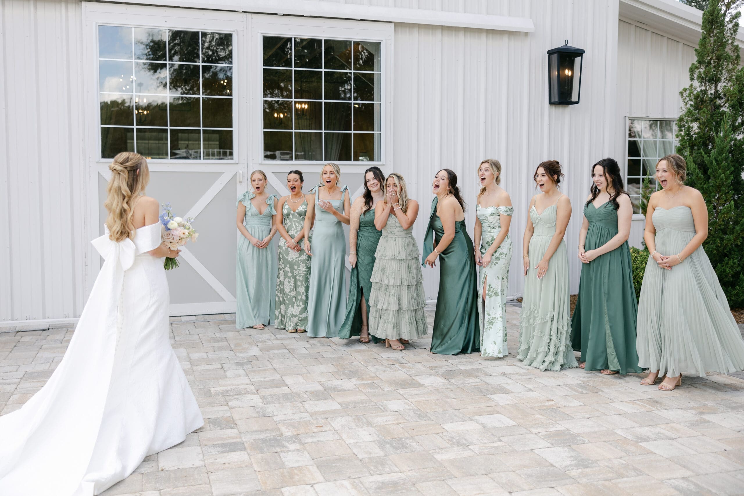 Mismatched green pattern and solid bridesmaids dresses